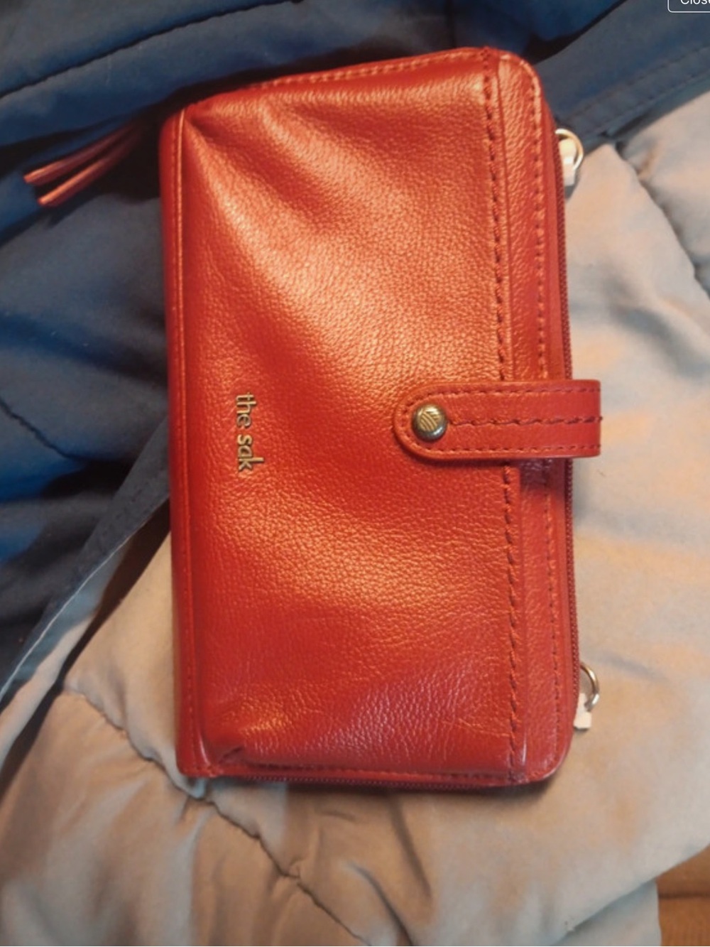 “Pre-Owned” Excellent Condition!The Sak Red Leather Zip-Around Wallet W/Snap Tab